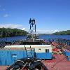 Tug " Fort Point" north bound in the Penobscot River transiting Crosby Narrows with Cianbro Corp's 140x100 Flexi-Float barge. (July 2010)