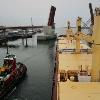 Tug "Winslow C. Kelsey" and bulk carrier "Jutta" approach Casco Bay Bridge outbound Portland Harbor.